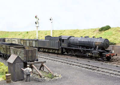 90434 passes through with loaded mineral wagons